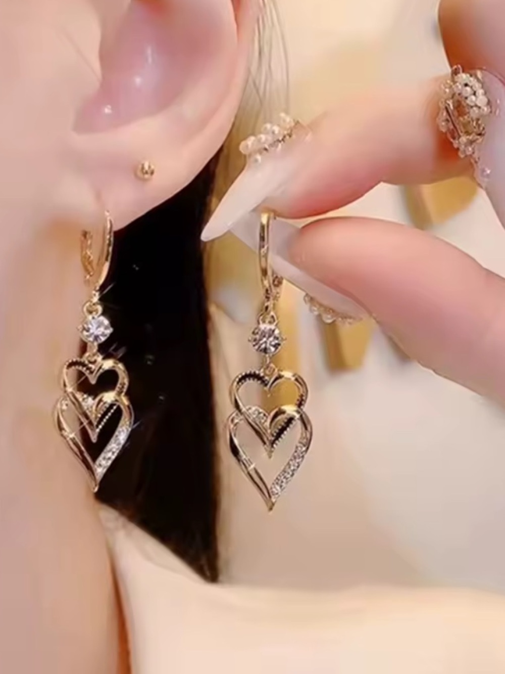 Anthropologie Gold Tone Heart Dangle Earrings with Clear Stones